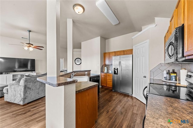 7831 Redbrush, Temple, TX 76502 - kitchen with black appliances, a sink, dark countertops, dark wood-style floors, and a ceiling fan