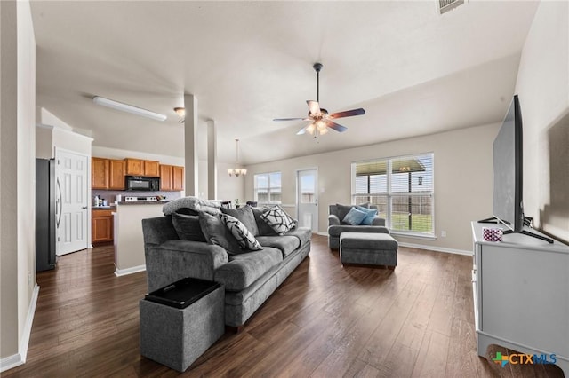 7831 Redbrush, Temple, TX 76502 - living room with dark wood finished floors, a ceiling fan, baseboards, and a chandelier