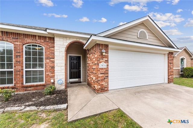 7831 Redbrush, Temple, TX 76502 - view of front of home featuring brick siding, a garage, and concrete driveway
