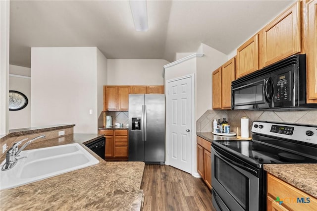 7831 Redbrush, Temple, TX 76502 - kitchen with black appliances, a sink, backsplash, dark wood-style flooring, and lofted ceiling