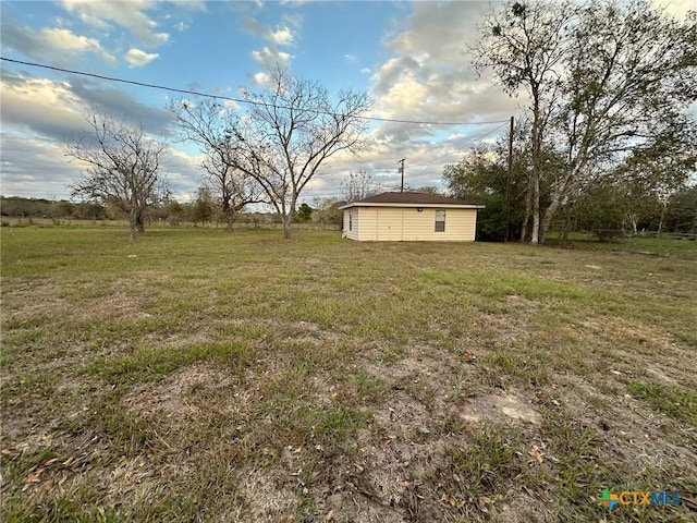 view of yard with a rural view