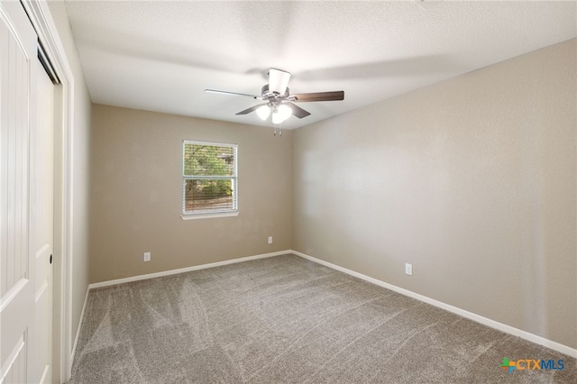 95 Mission Dr, New Braunfels, TX 78130 - spare room featuring a ceiling fan, baseboards, and carpet floors