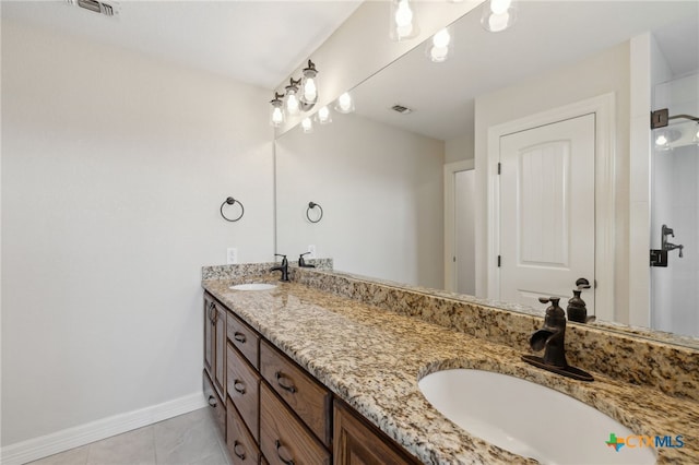 95 Mission Dr, New Braunfels, TX 78130 - full bathroom with double vanity, baseboards, tile patterned flooring, and a sink