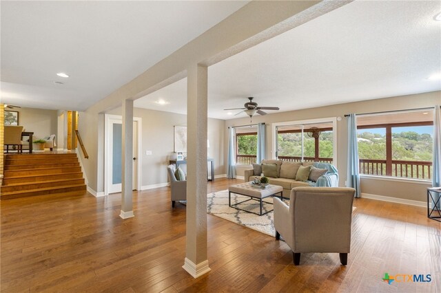 95 Mission Dr, New Braunfels, TX 78130 - living area featuring a ceiling fan, recessed lighting, baseboards, hardwood / wood-style flooring, and stairway