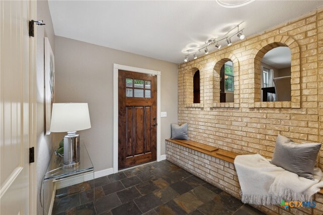 95 Mission Dr, New Braunfels, TX 78130 - foyer entrance featuring baseboards and stone finish flooring