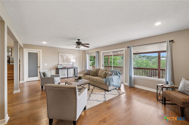 95 Mission Dr, New Braunfels, TX 78130 - living area with wood finished floors, baseboards, a ceiling fan, and recessed lighting