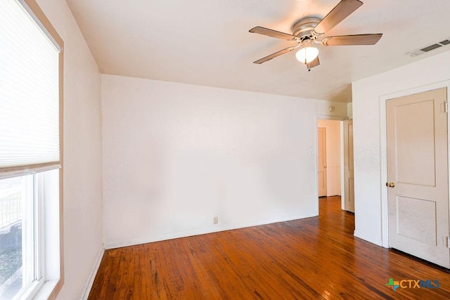 1707 S 43rd St, Temple, TX 76504 - unfurnished room with wood finished floors, ceiling fan, and baseboards