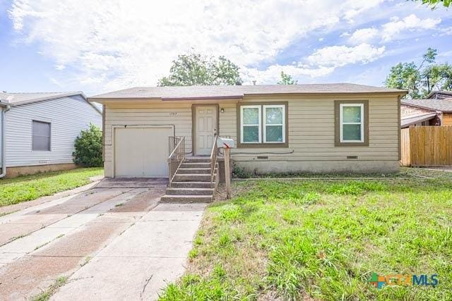 1707 S 43rd St, Temple, TX 76504 - single story home featuring an attached garage, concrete driveway, and crawl space