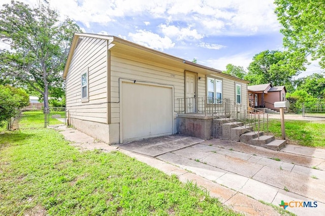 1707 S 43rd St, Temple, TX 76504 - view of front of property featuring concrete driveway, a gate, and a garage