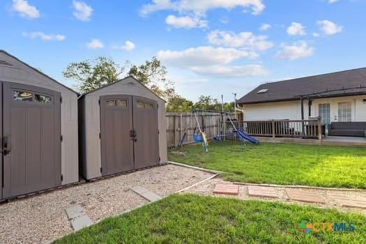 2305 Canyon Creek Dr, Temple, TX 76502 - view of yard featuring a shed, an outdoor structure, and a playground