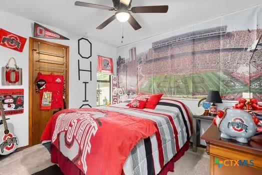 2305 Canyon Creek Dr, Temple, TX 76502 - carpeted bedroom featuring a ceiling fan