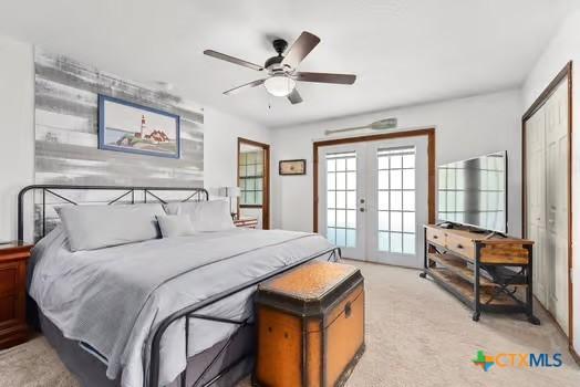 2305 Canyon Creek Dr, Temple, TX 76502 - bedroom featuring french doors, access to exterior, light carpet, and a ceiling fan