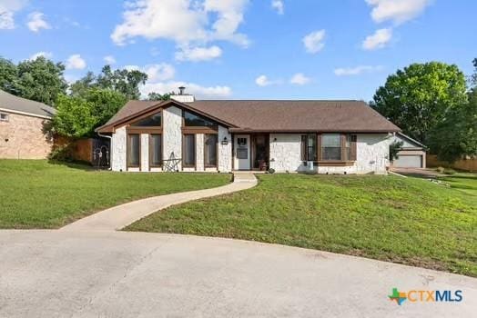 2305 Canyon Creek Dr, Temple, TX 76502 - view of front of house with stone siding and a front yard