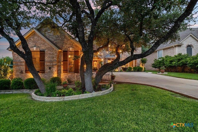 1800 Bluffwood Pl, Round Rock, TX 78665 - view of front of property with driveway, a front yard, and brick siding
