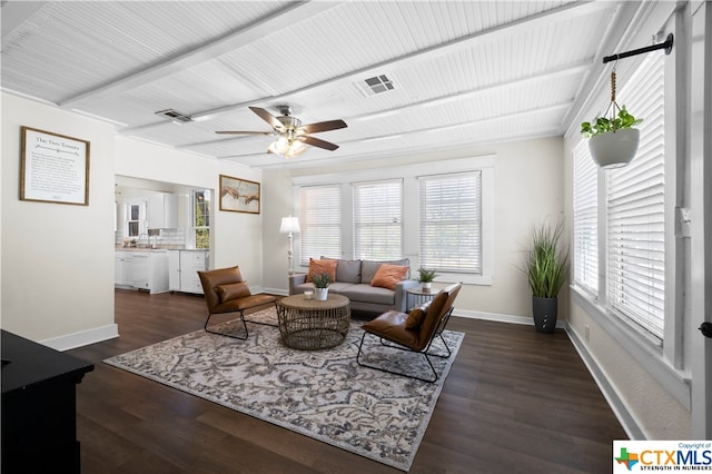 living room featuring ceiling fan and dark hardwood / wood-style floors