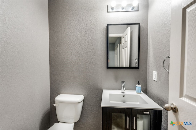 7631 Sterling Mnr, Converse, TX 78109 - half bath featuring vanity and a textured wall