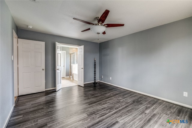 7631 Sterling Mnr, Converse, TX 78109 - unfurnished bedroom featuring dark wood-style floors and a ceiling fan