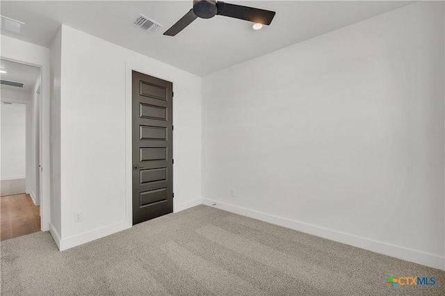 carpeted empty room with ceiling fan