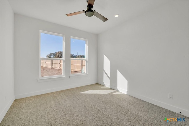 carpeted empty room with ceiling fan