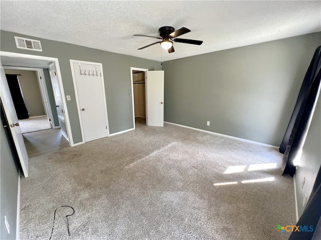 105 Kensington Dr, Victoria, TX 77901 - unfurnished bedroom featuring a textured ceiling, carpet floors, baseboards, and ceiling fan