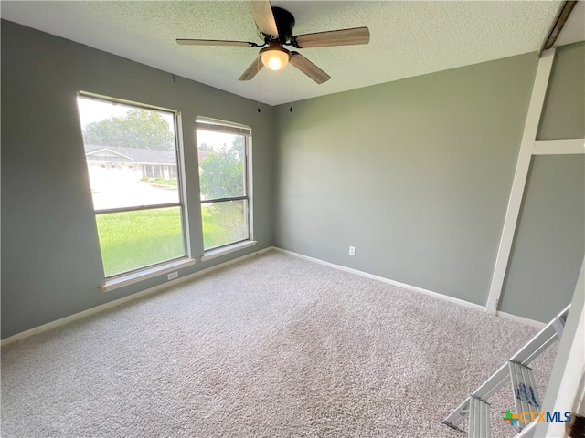 105 Kensington Dr, Victoria, TX 77901 - carpeted empty room featuring a ceiling fan, a textured ceiling, and baseboards