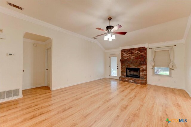 4700 Aurora Cir, Killeen, TX 76542 - unfurnished living room with wood finished floors, a ceiling fan, ornamental molding, a fireplace, and baseboards