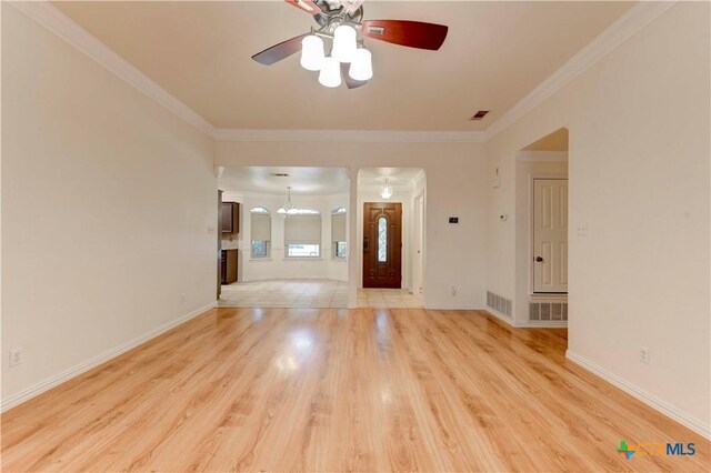 4700 Aurora Cir, Killeen, TX 76542 - foyer with light wood-style floors, ceiling fan, ornamental molding, baseboards, and a chandelier
