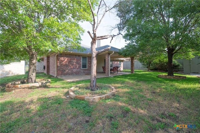 4700 Aurora Cir, Killeen, TX 76542 - rear view of house featuring a patio area and brick siding