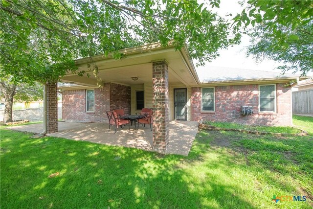 4700 Aurora Cir, Killeen, TX 76542 - back of property featuring a patio area and brick siding