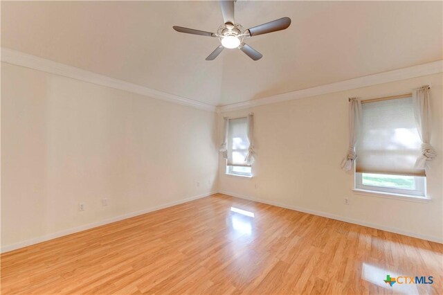 4700 Aurora Cir, Killeen, TX 76542 - spare room with healthy amount of natural light, wood finished floors, ceiling fan, baseboards, and vaulted ceiling