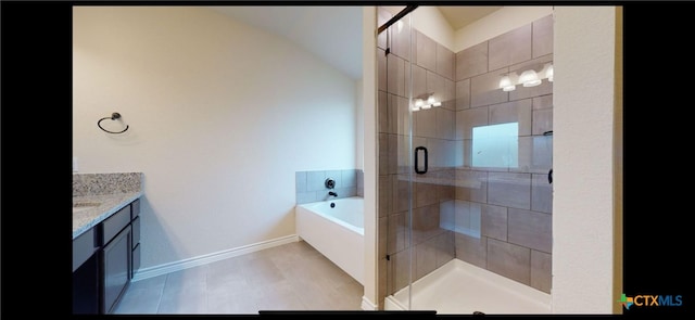 full bath with vanity, a garden tub, baseboards, and a stall shower