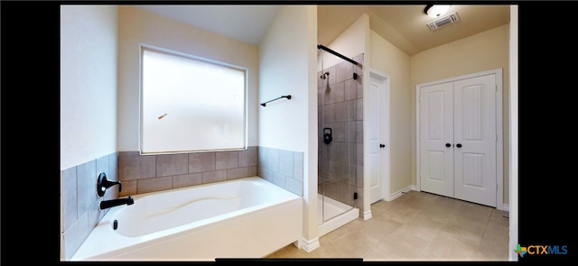 full bathroom with visible vents, a bath, and a shower stall