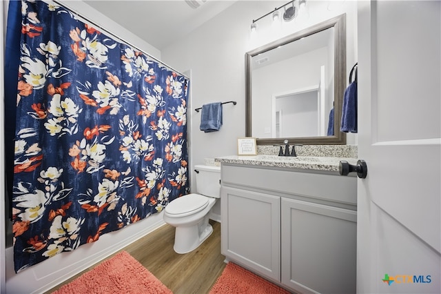 711 Saddlehorn Dr, Temple, TX 76502 - bathroom featuring wood finished floors, toilet, and vanity