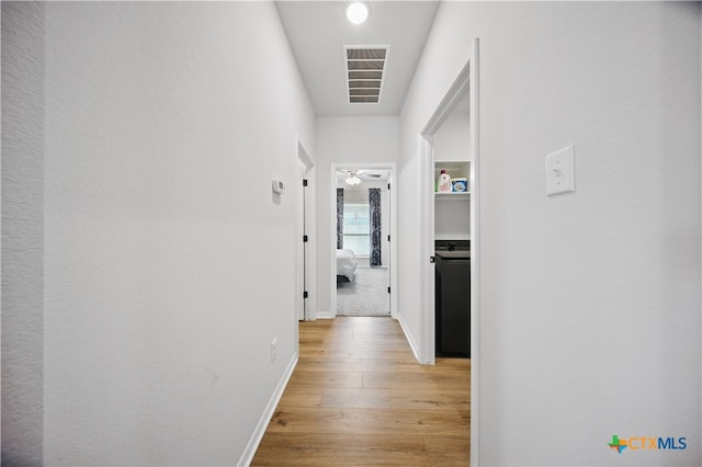 711 Saddlehorn Dr, Temple, TX 76502 - corridor with light wood-type flooring and baseboards