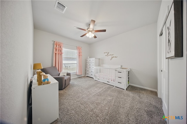 711 Saddlehorn Dr, Temple, TX 76502 - carpeted bedroom featuring a nursery area, ceiling fan, and baseboards