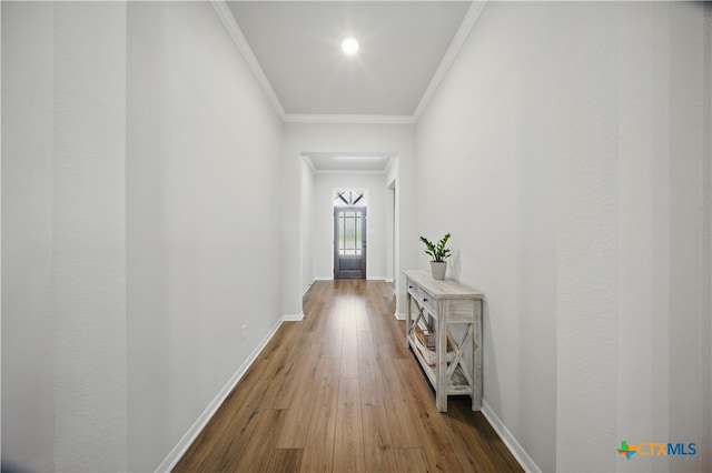 711 Saddlehorn Dr, Temple, TX 76502 - hallway with ornamental molding, baseboards, and wood finished floors
