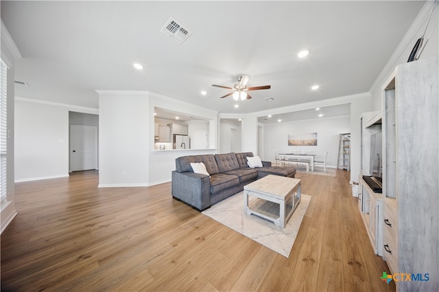 711 Saddlehorn Dr, Temple, TX 76502 - living area featuring a ceiling fan, ornamental molding, light wood-style flooring, recessed lighting, and baseboards
