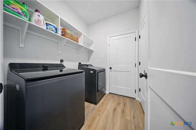 711 Saddlehorn Dr, Temple, TX 76502 - washroom featuring light wood-style floors and separate washer and dryer
