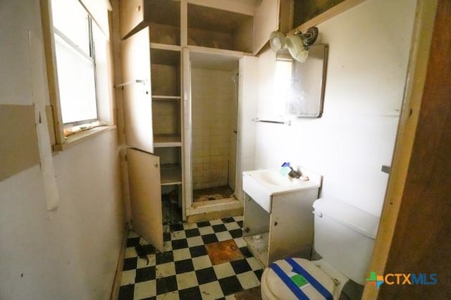 626 E Wallace St, Gonzales, TX 78629 - bathroom featuring vanity, tile patterned floors, and walk in shower