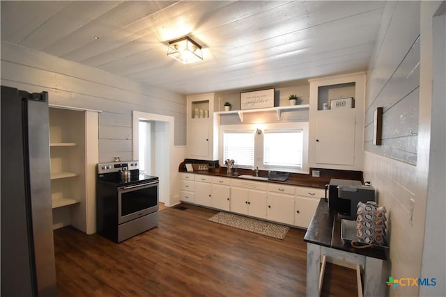 kitchen with open shelves, a sink, dark countertops, appliances with stainless steel finishes, and white cabinets