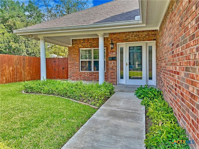 doorway to property with a yard