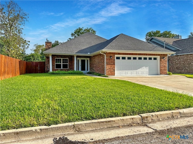 view of front facade with a front lawn and a garage