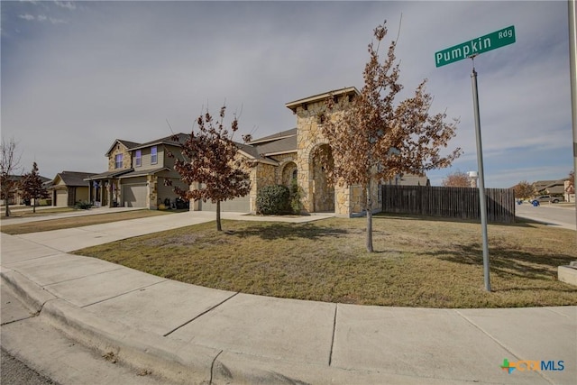 view of front of house featuring a garage and a front yard