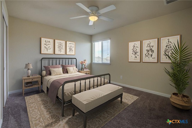 bedroom featuring dark carpet and ceiling fan