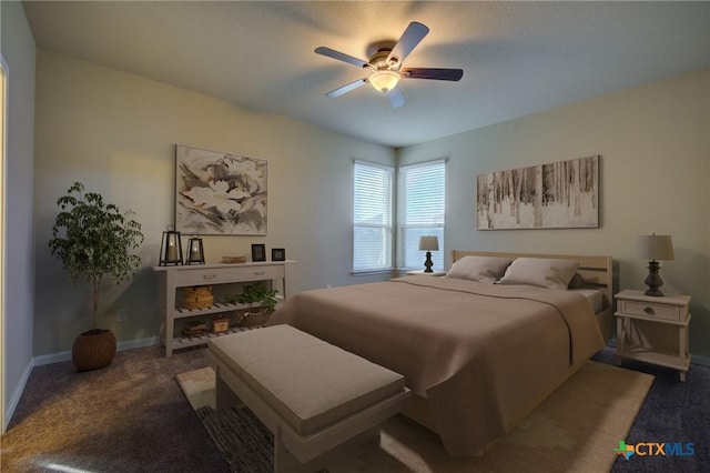 bedroom featuring ceiling fan and carpet