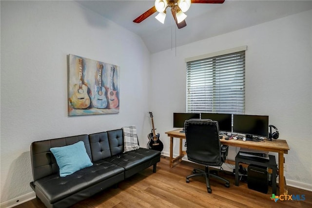 office featuring ceiling fan, vaulted ceiling, and wood-type flooring