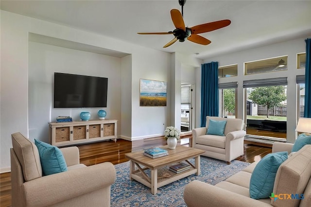 living room with hardwood / wood-style flooring and ceiling fan