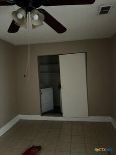 interior space with tile patterned floors and washer / clothes dryer