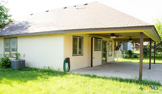 back of house featuring central AC, ceiling fan, and a patio