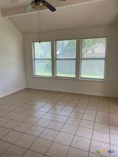 tiled empty room featuring vaulted ceiling with beams and ceiling fan